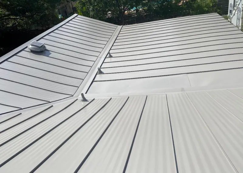 Solar attic fan installed on a metal roof for Roof Ventilation in Weiser